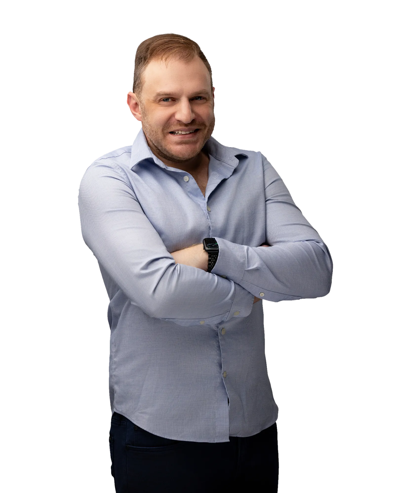 Drew Golub in a rolled-sleeve shirt, arms crossed, smiling